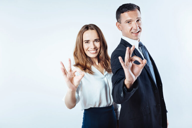 Positive minded entrepreneurs gesturing ok sign